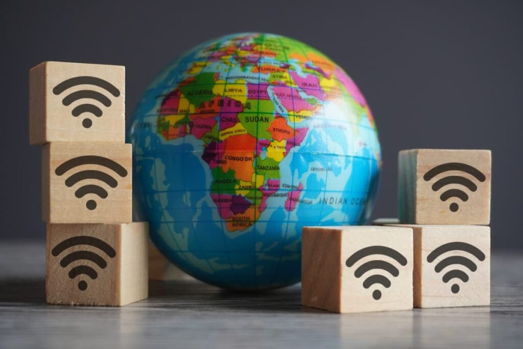 closeup-image-of-globe-and-wooden-cubes-with-wifi-2026-01-08-22-27-59-utc-scaled